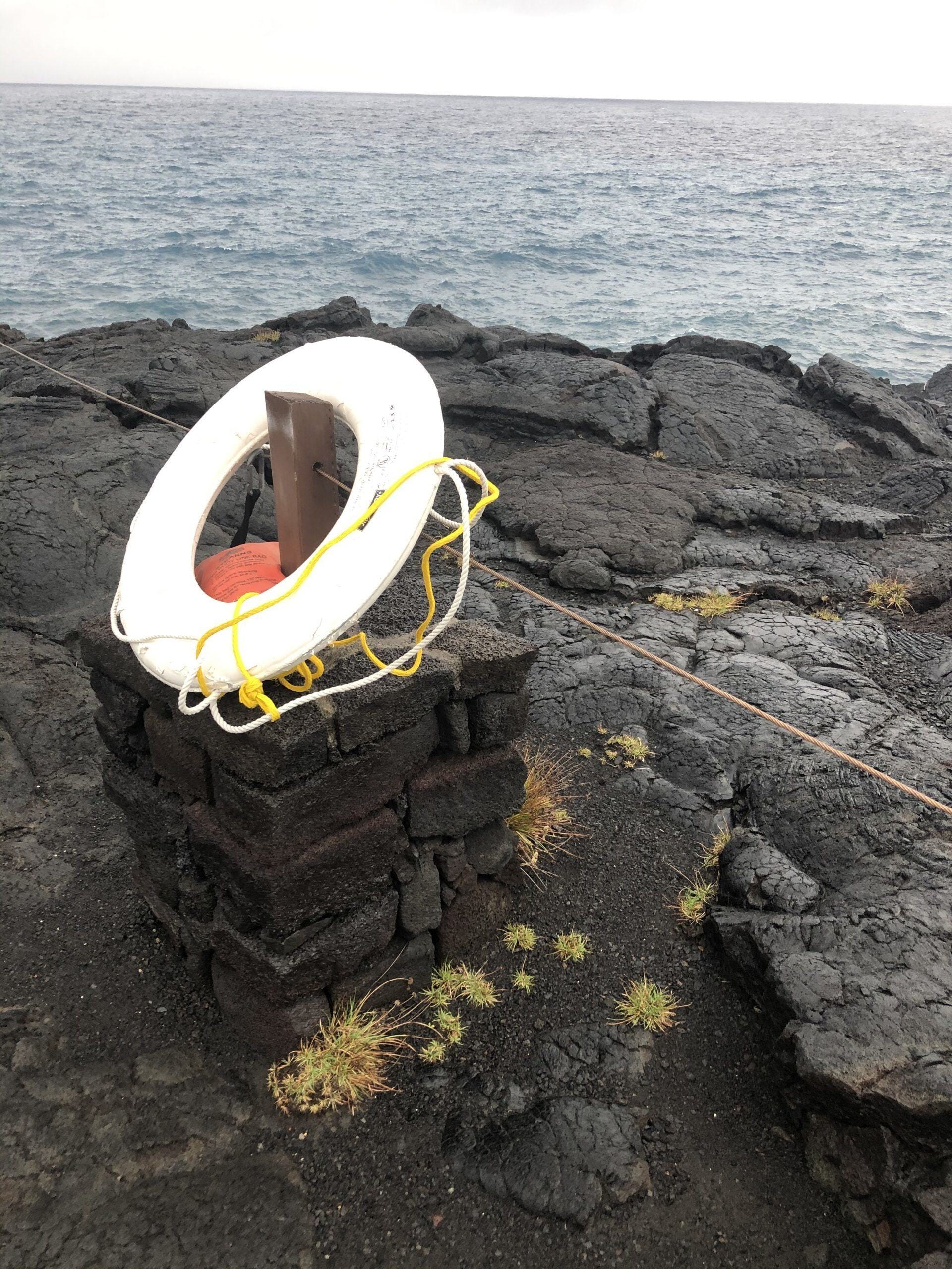 Rescue ring on black lava