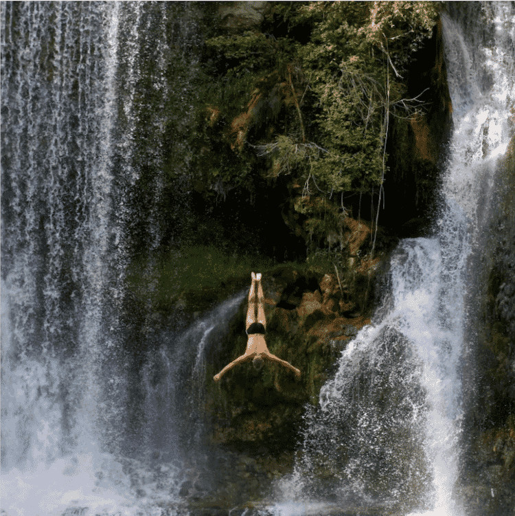 Diver in a water fall.