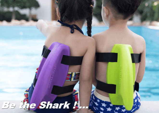Shark Fin, kids sit on side of pool