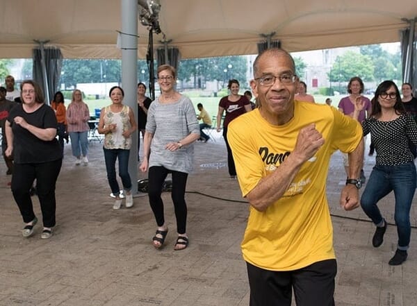 Catherine and Elaine in the front row, left and right, follow along with the dance leader, Roland. May he rest in peace. He was a great community leader and we worked together for many summers with PPS students at Summer Dreamers.